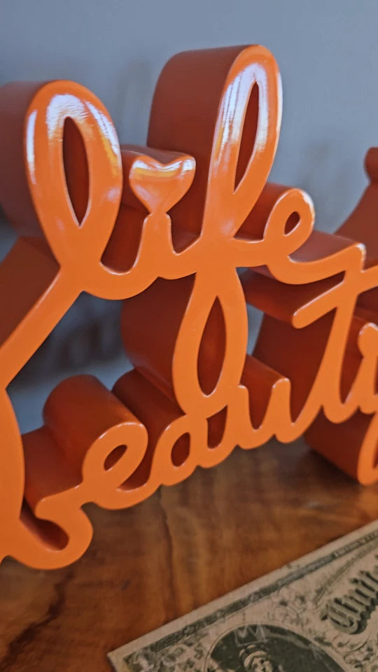 LIFE IS BEAUTIFUL SCULPTURE (TANGERINE) BY MR. BRAINWASH